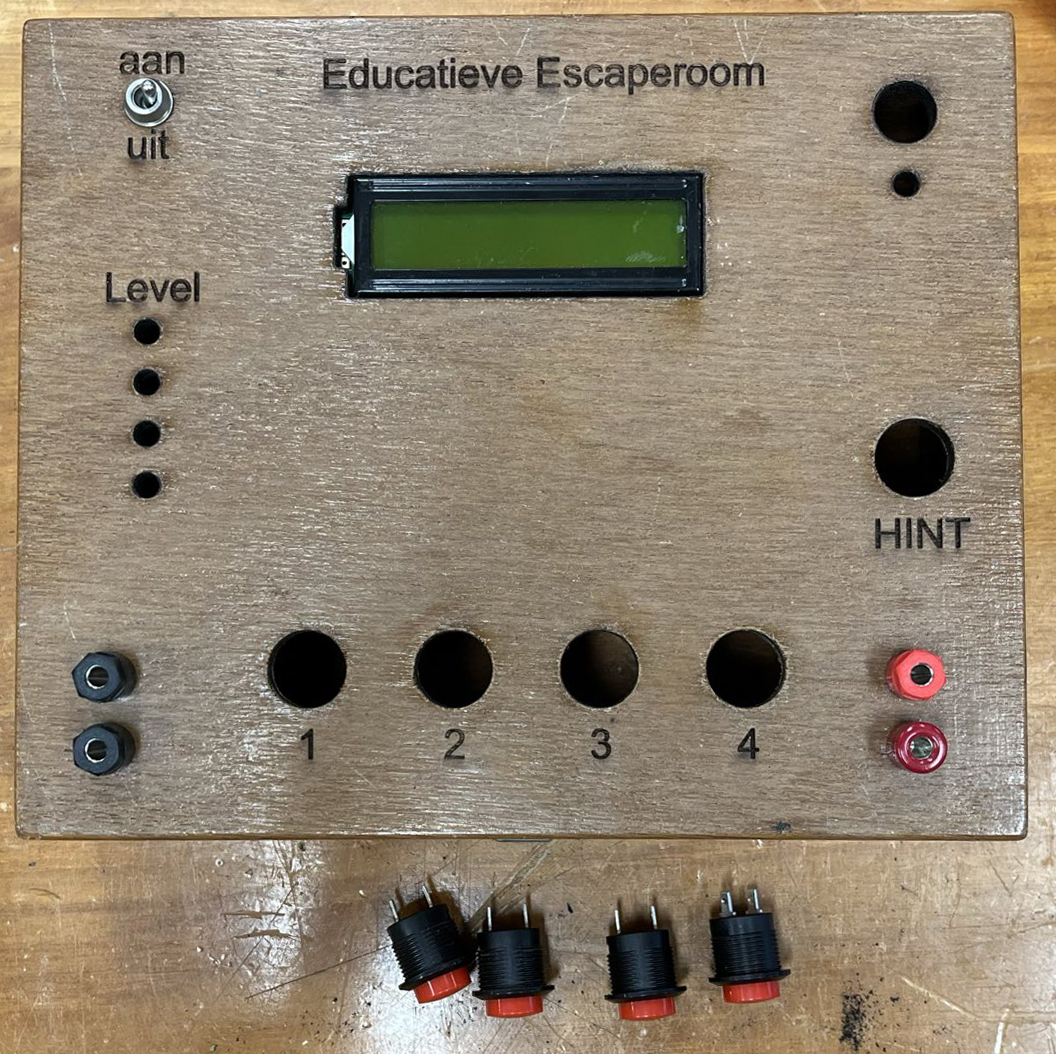 Top view of the tea box with holes for buttons, leds, buzzer, and LCD screen.