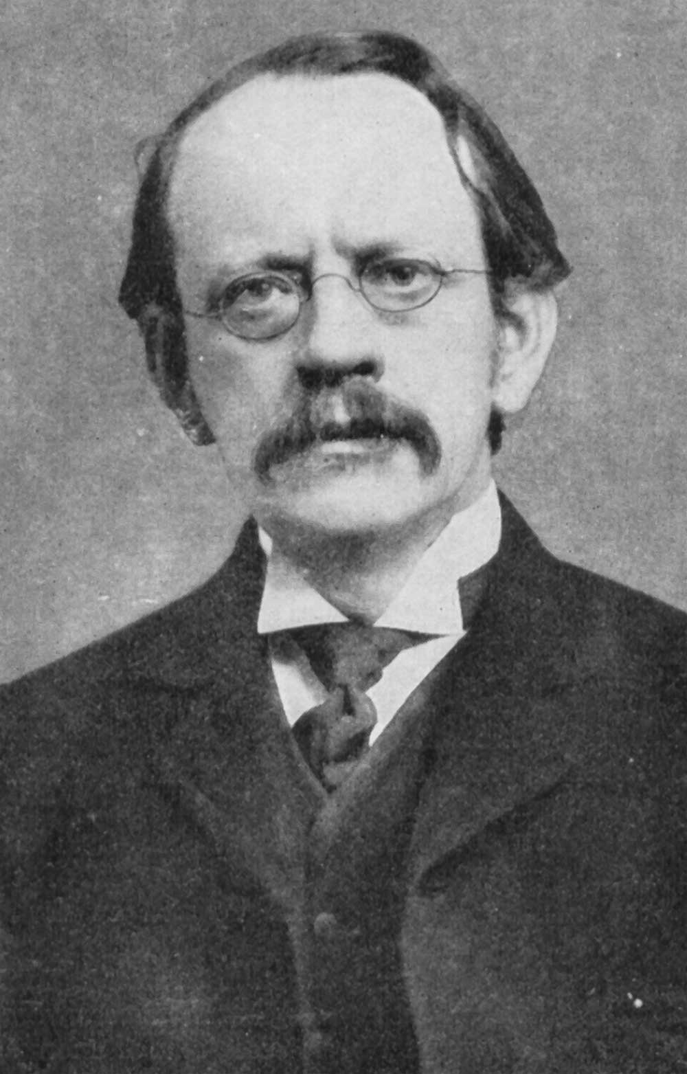 Joseph John Thomson (1856-1940). From Wikimedia Commons, public domain.
Thomson refined the idea of the atomic model: electrons moving within the atom, though the atom is still neutral in charge.