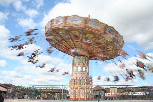 Spinning carousel. By Oxana Mayer, from Wikimedia Commons, licensed under CC BY-SA 2.0.