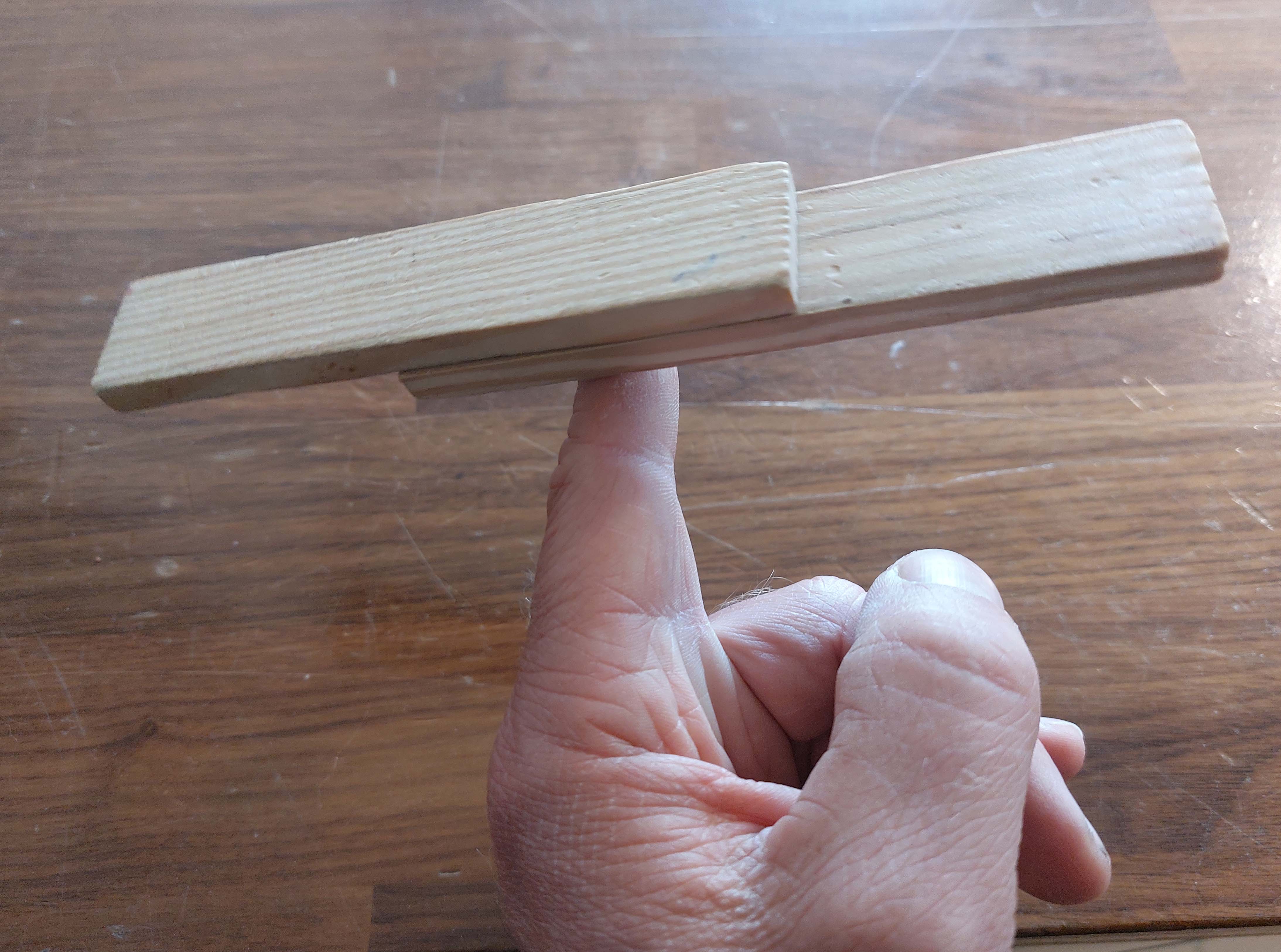 finger used to balance two block