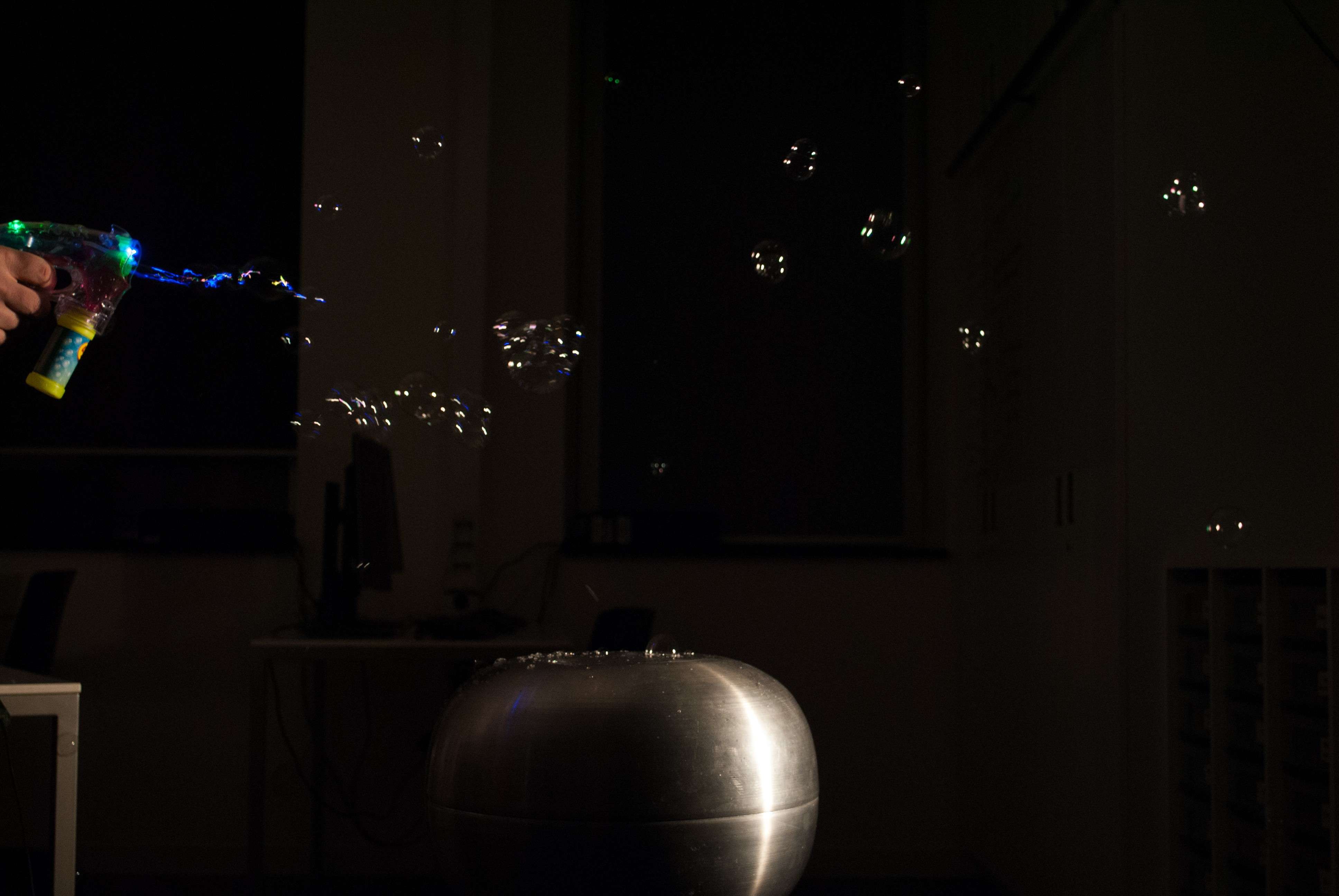 soap bubbles above a Van de Graaff generator