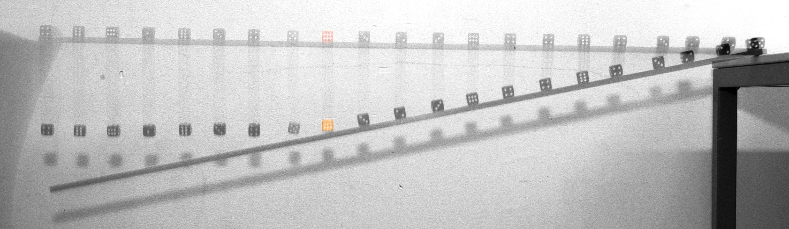 a turning rod with dices on it at the right but at the left dices are above the rod