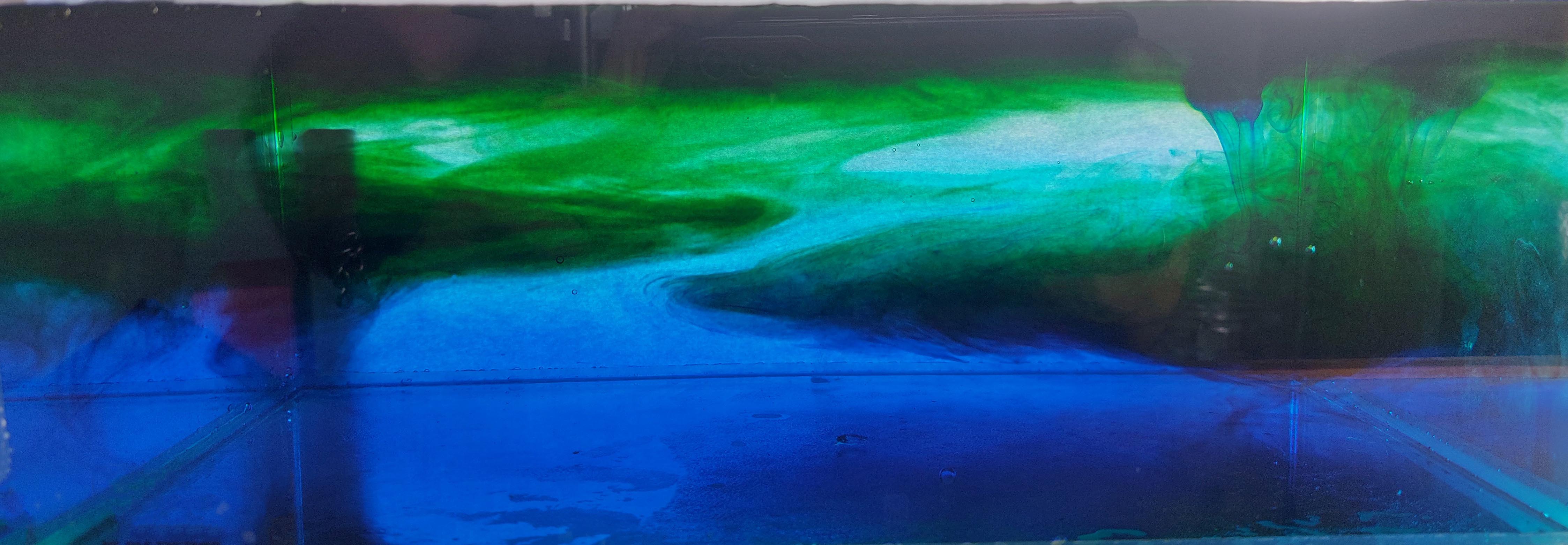 aquarium with blue and green water showing the flow of heat / cold spots.