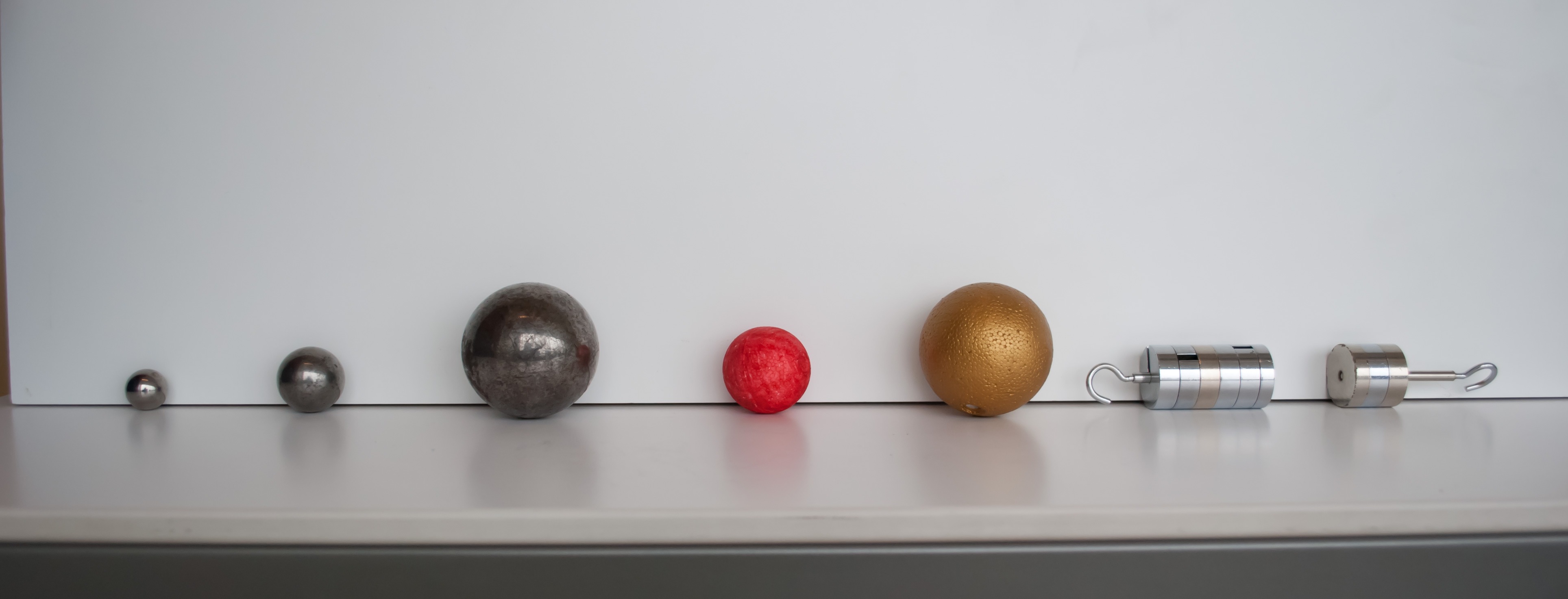several objects that can roll lined up