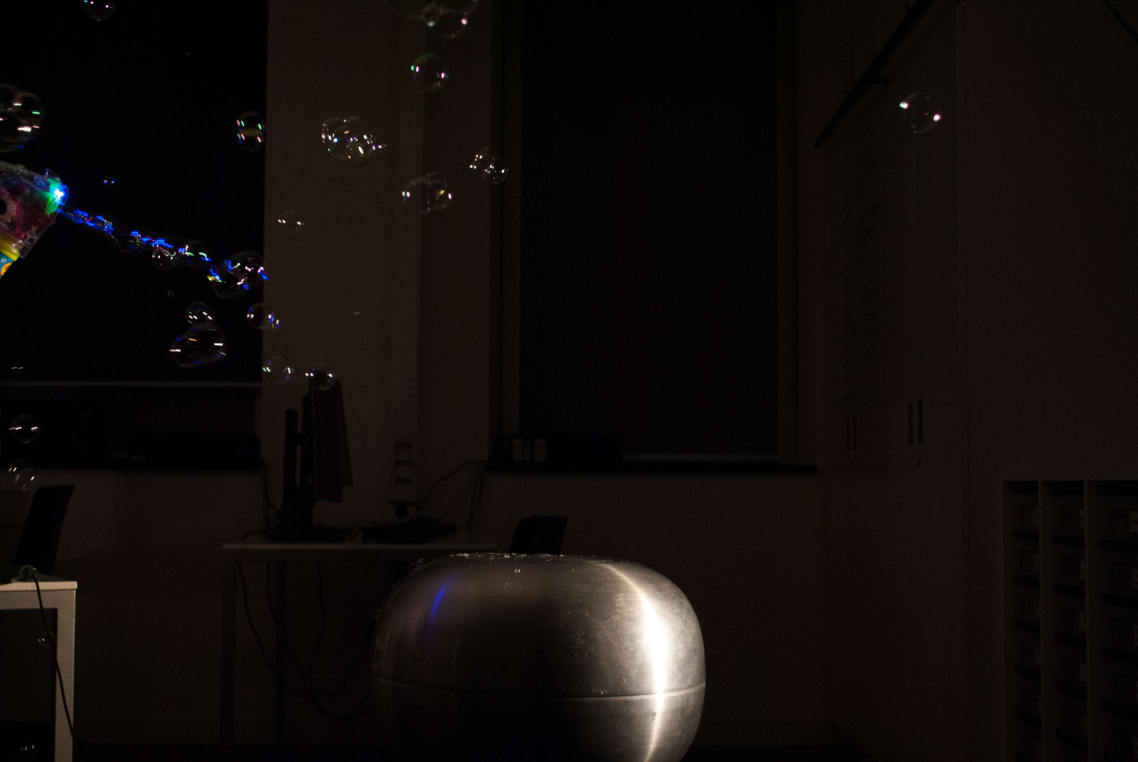 soapbells above a Van der Graaf generator, which is a charged metal ball